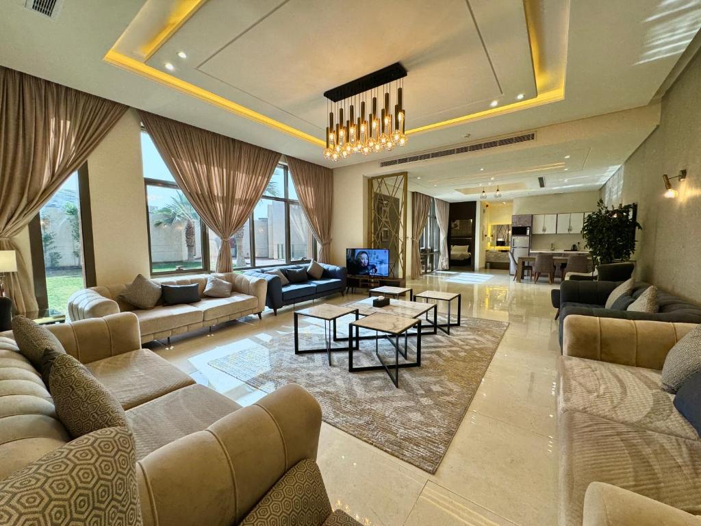 a large living room with couches and a table at شاليهات ديلان in Riyadh