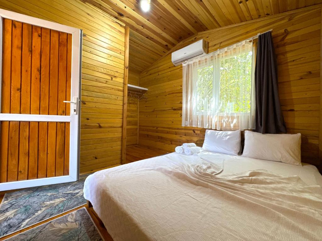 Postel nebo postele na pokoji v ubytování Venüs Gold Bungalov Adrasan