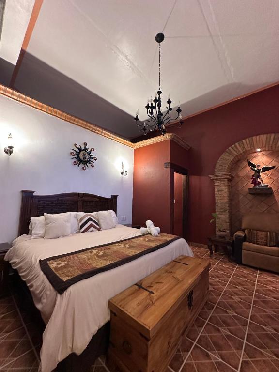 Postel nebo postele na pokoji v ubytování Copa de Oro Hotel Boutique