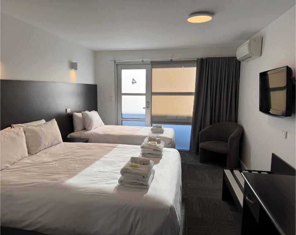 Postel nebo postele na pokoji v ubytování Brighton Hotel Motel