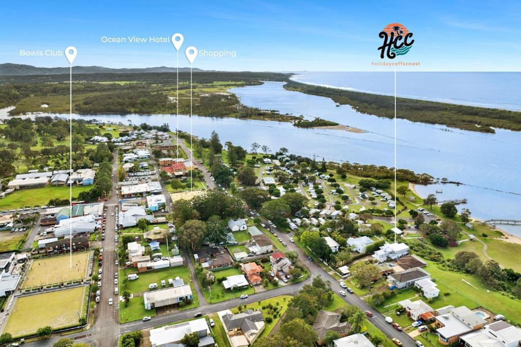 an aerial view of a town next to the water at Urunga Magic 1A in Urunga