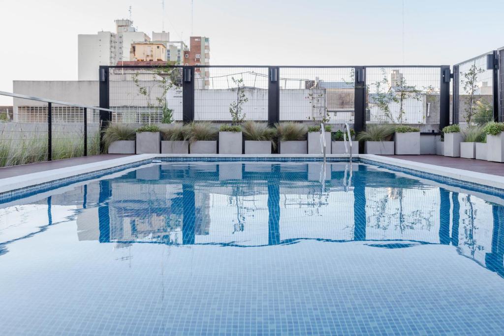a swimming pool on the roof of a building at Departamento Las Lomitas in Lomas de Zamora