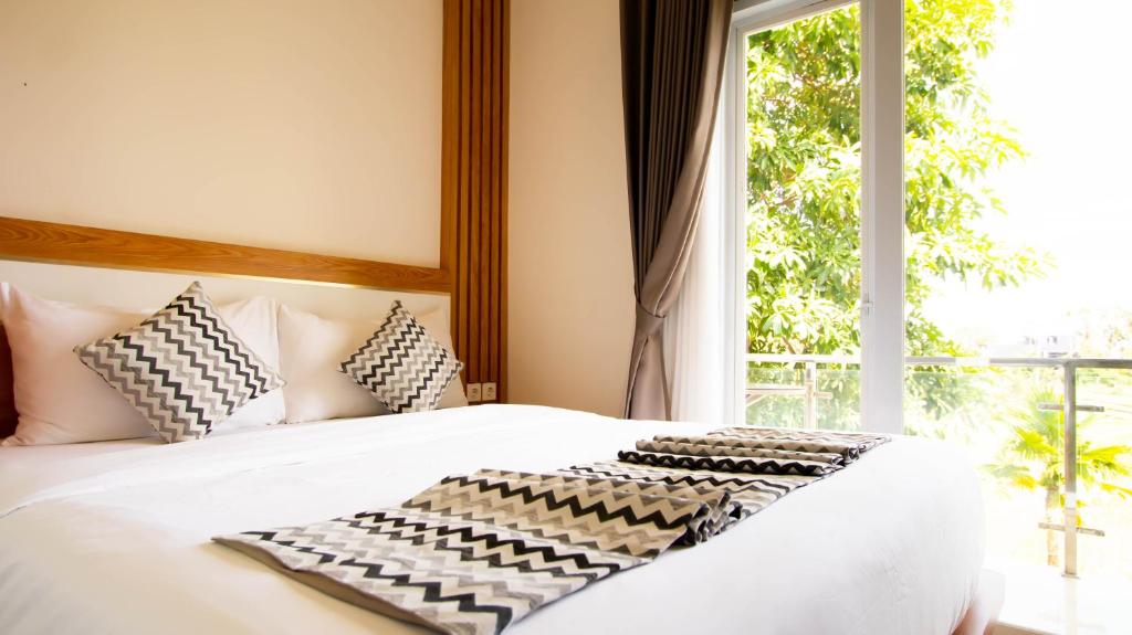 Postel nebo postele na pokoji v ubytování Padi Villa Canggu