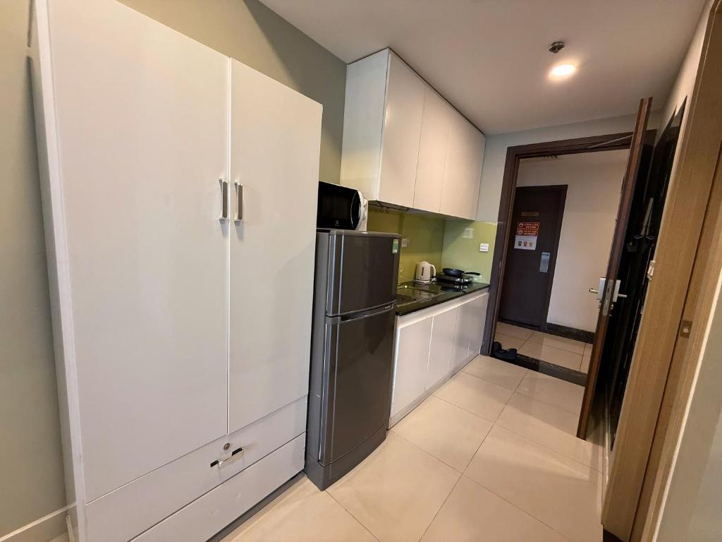 Kuchyň nebo kuchyňský kout v ubytování Lovely SaiGon Apartment