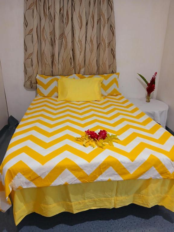 Postel nebo postele na pokoji v ubytování Grace Homestay