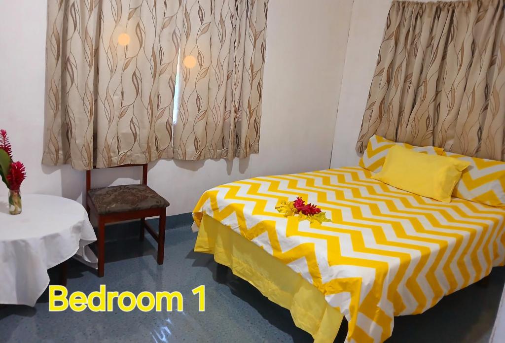 Postel nebo postele na pokoji v ubytování Grace Homestay