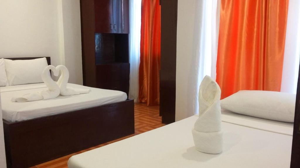 Postel nebo postele na pokoji v ubytování Ricardo Valley Inn