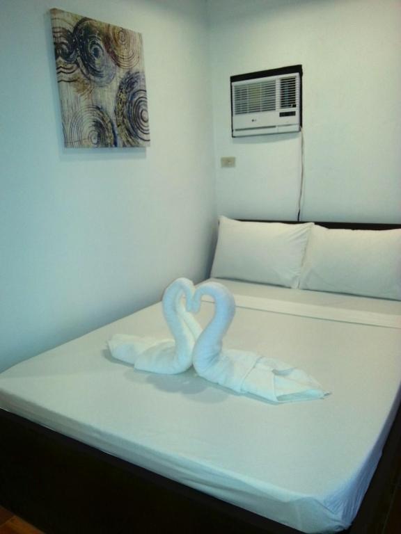 Postel nebo postele na pokoji v ubytování Ricardo Valley Inn