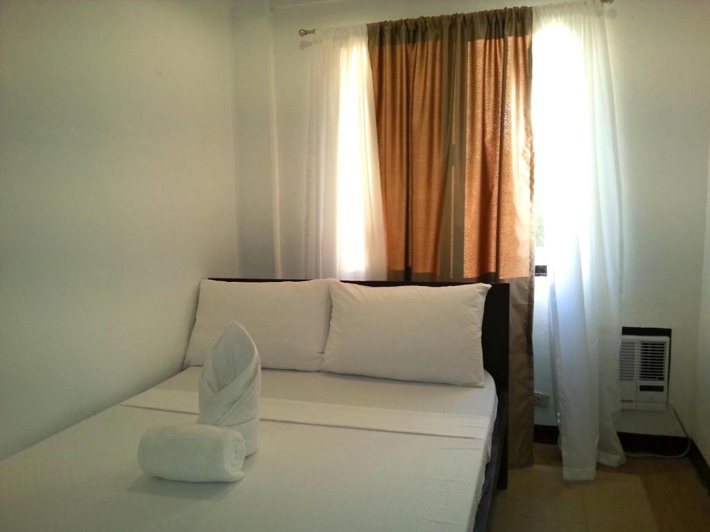Postel nebo postele na pokoji v ubytování Ricardo Valley Inn