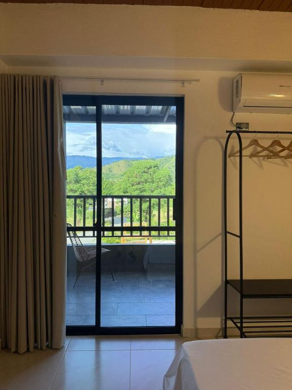 Postel nebo postele na pokoji v ubytování Ivanna Hotel Campestre