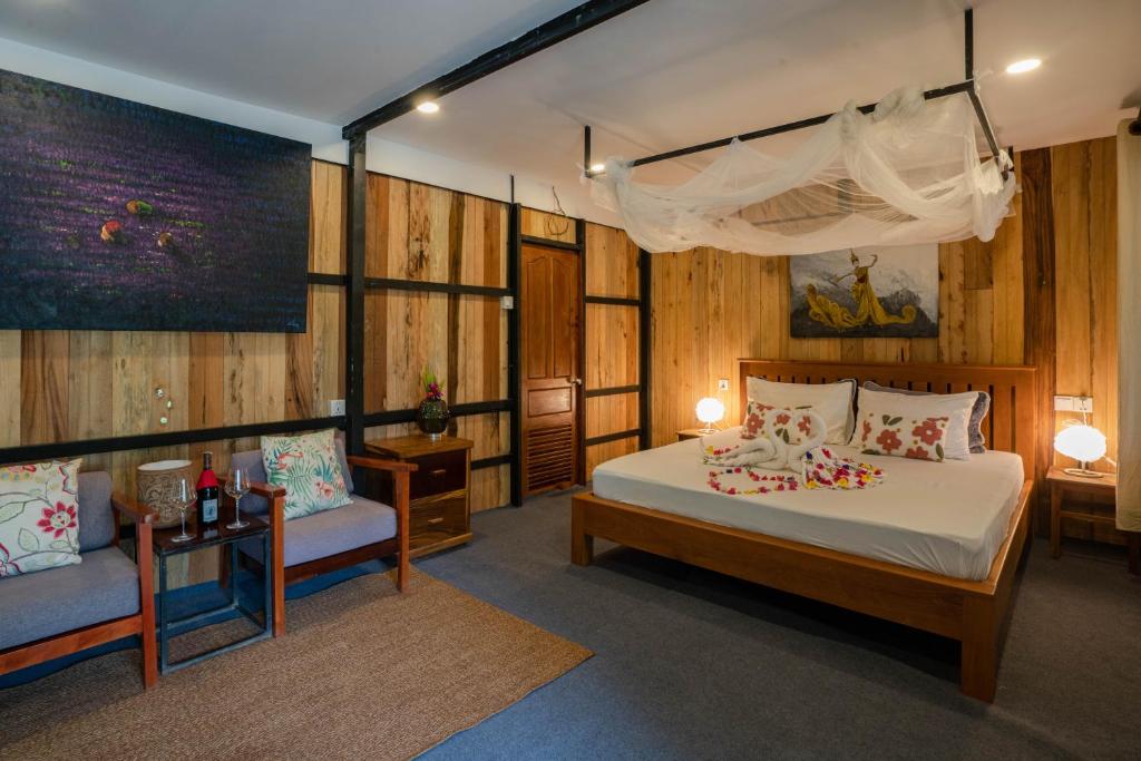 Postel nebo postele na pokoji v ubytování Beng Mealea Lodge