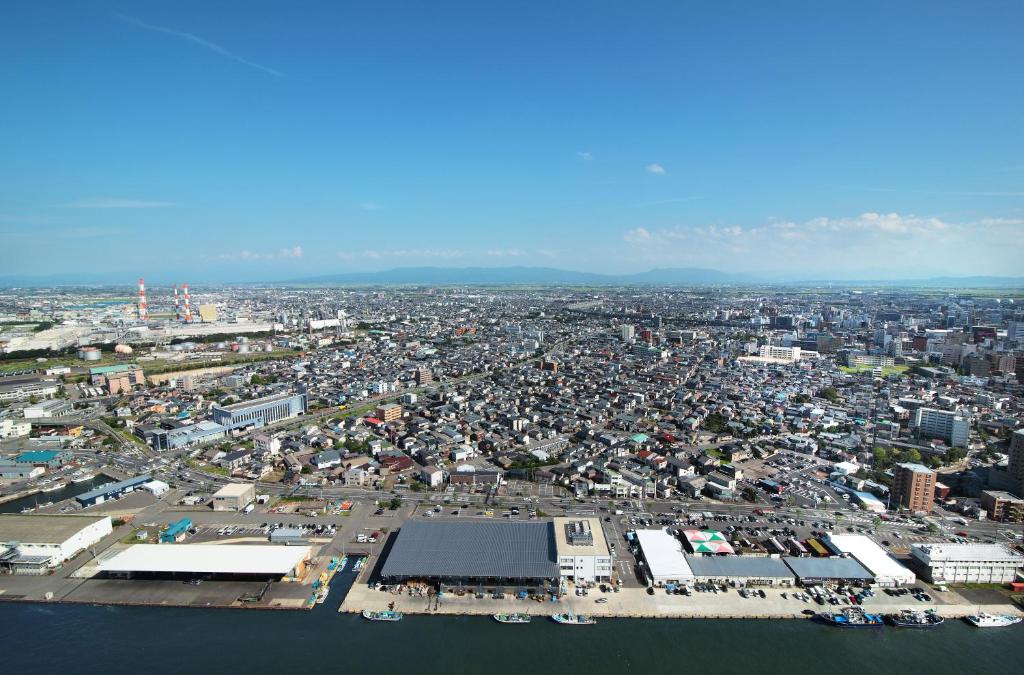 an aerial view of a city with a lot of buildings at Hotel Nikko Niigata in Niigata