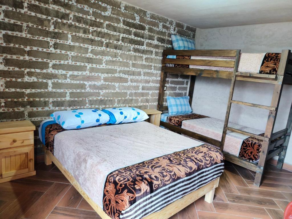 Postel nebo postele na pokoji v ubytování cabañas Ticomulco