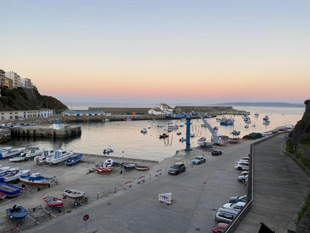 a group of boats in the water at a harbor at Apartamento Mar Malpica, Camiño dos faros Costa da morte in Malpica
