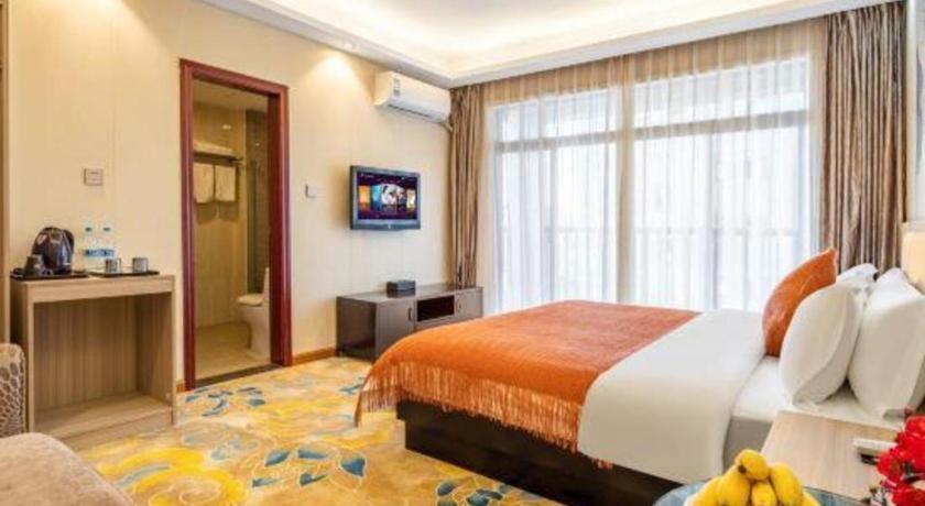 Postel nebo postele na pokoji v ubytování Oriental Hotel