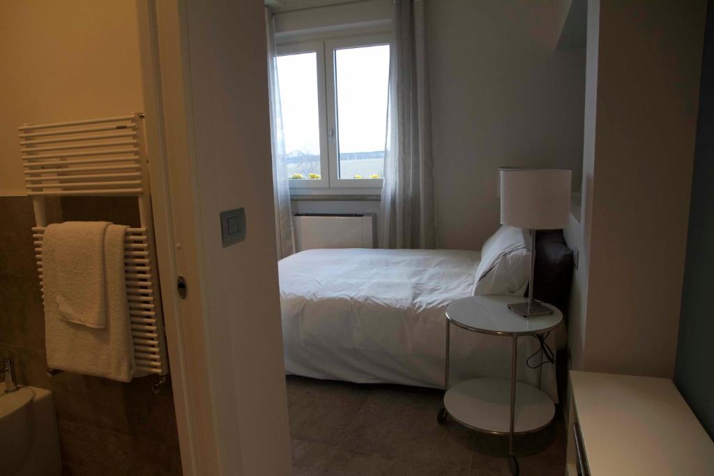 Postel nebo postele na pokoji v ubytování Cascina Belmonte