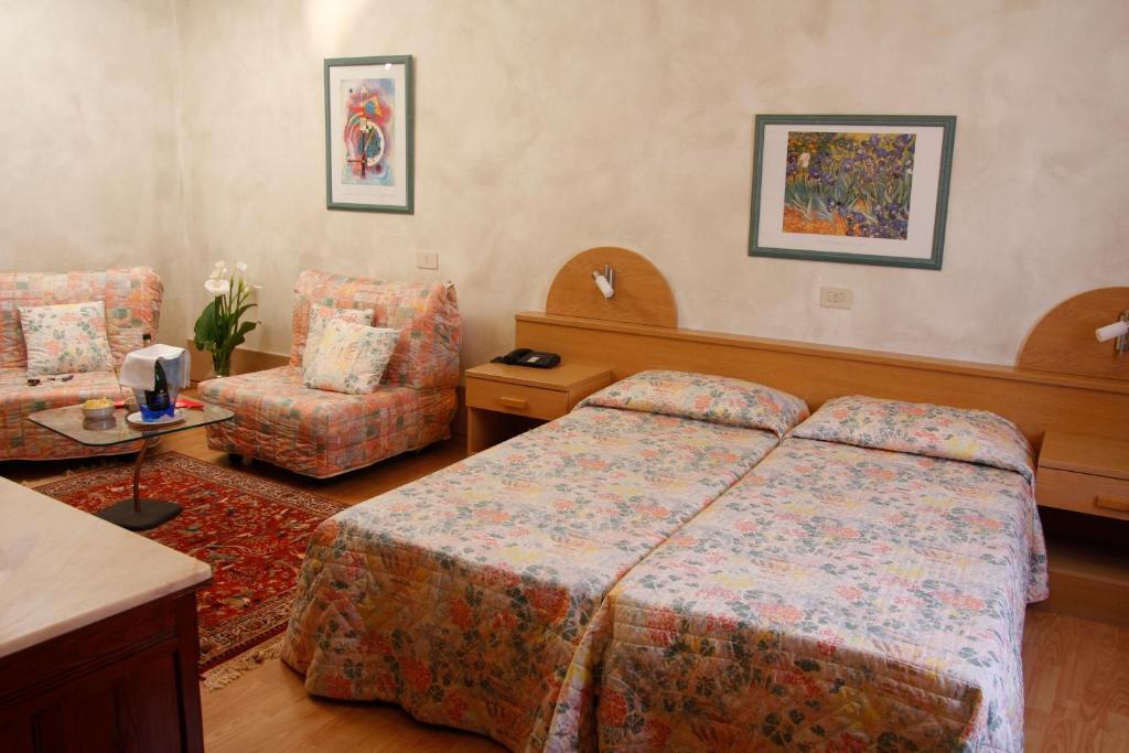 Postel nebo postele na pokoji v ubytování Hotel Centro