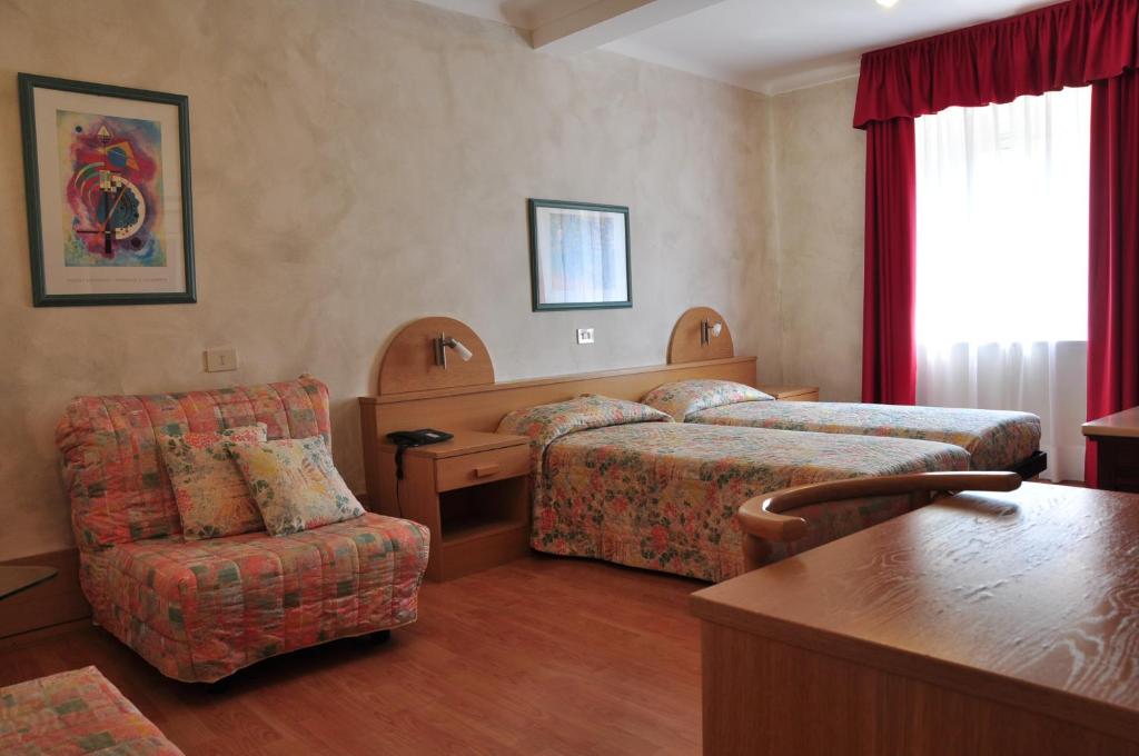 Postel nebo postele na pokoji v ubytování Hotel Centro