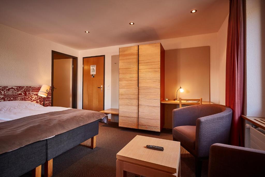 Postel nebo postele na pokoji v ubytování Hotel Landhaus