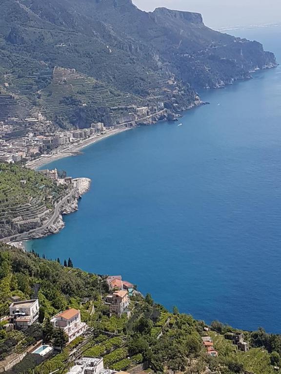 a view of a large body of water with houses at Villa Anna Rosa in Ravello