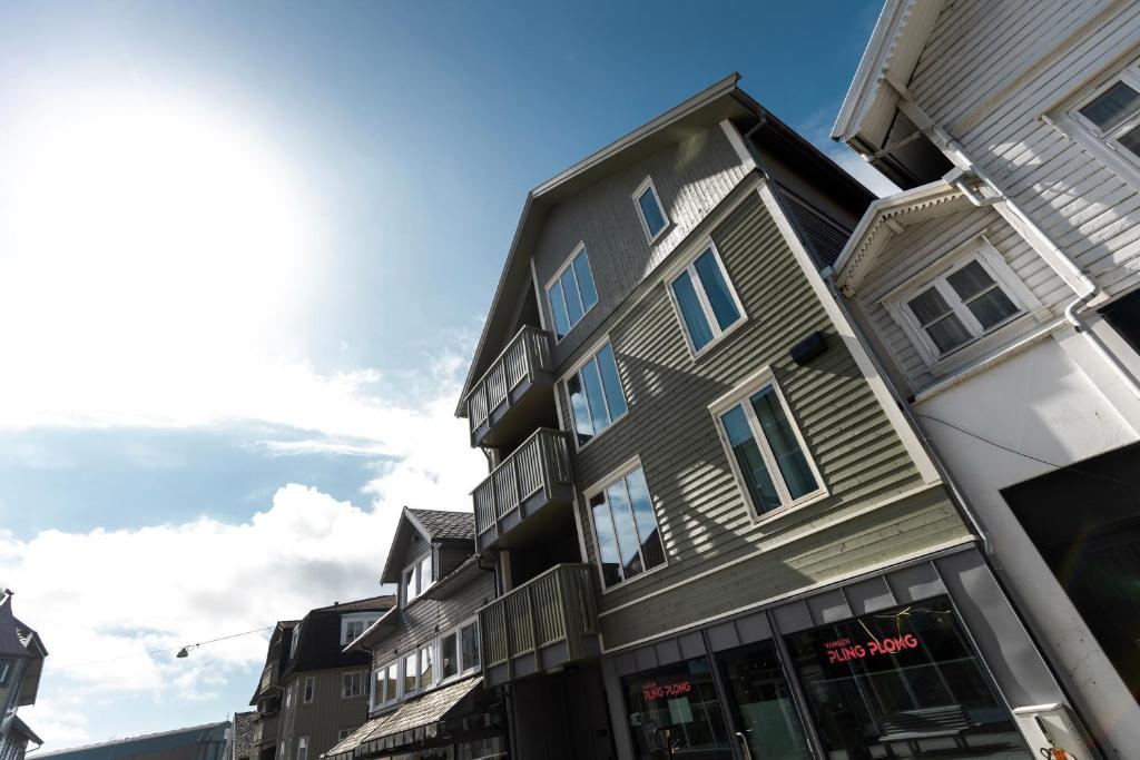 a tall building on a city street at Bris Apartments in Haugesund