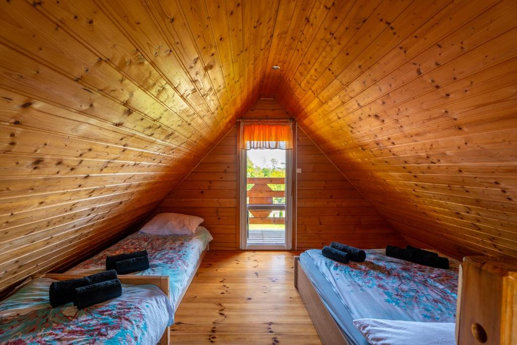 Postel nebo postele na pokoji v ubytování Domki Sielanka