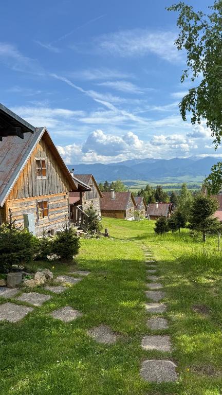 a path in a field next to a house at Bungalovy Baranec in Žiar