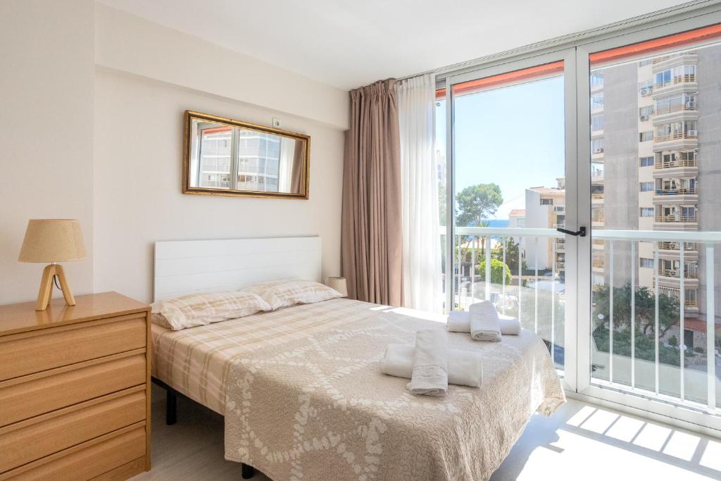 Postel nebo postele na pokoji v ubytování Apartamento Frente al Mar Con Parking