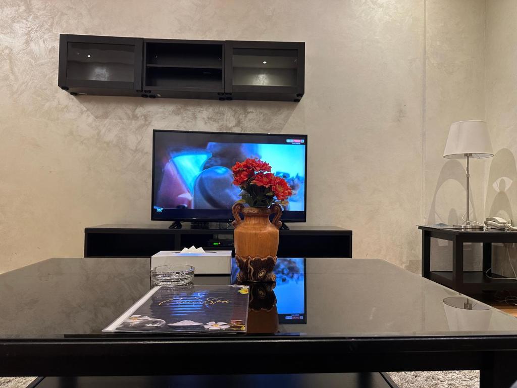TV a/nebo společenská místnost v ubytování Le Park Hotel