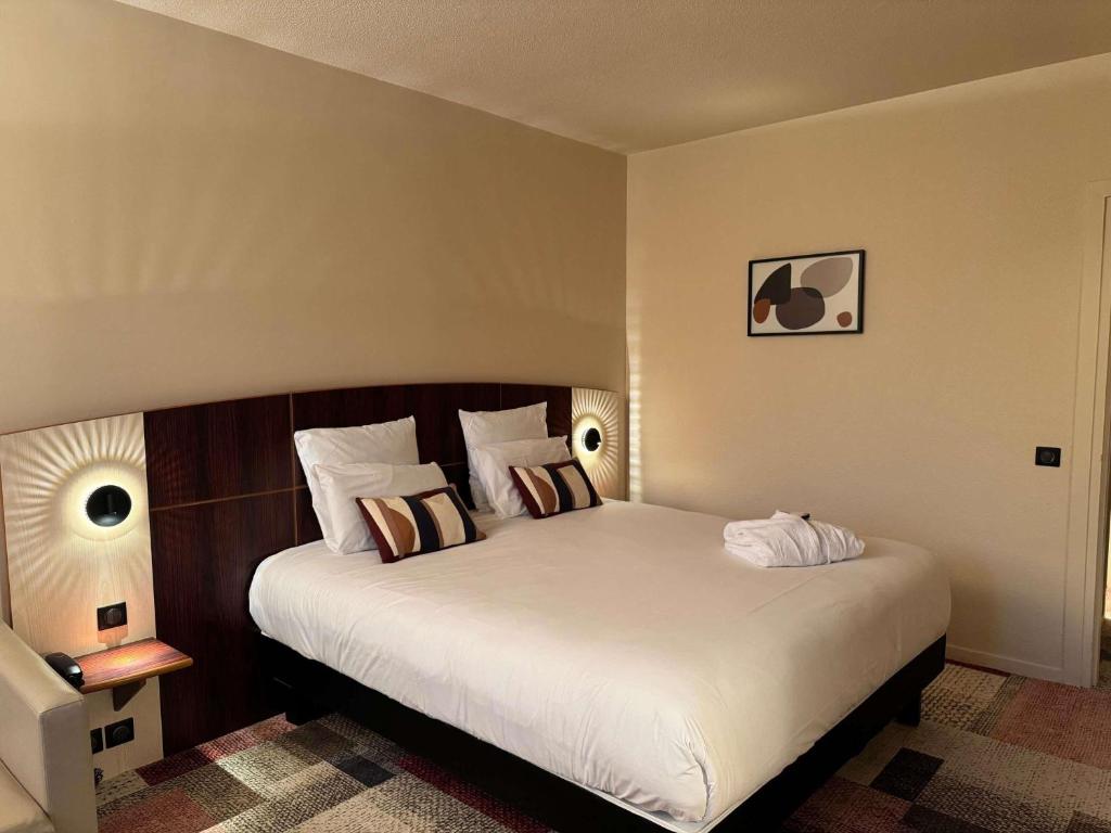 Postel nebo postele na pokoji v ubytování Mercure Besancon Parc Micaud - Hotel & Bar