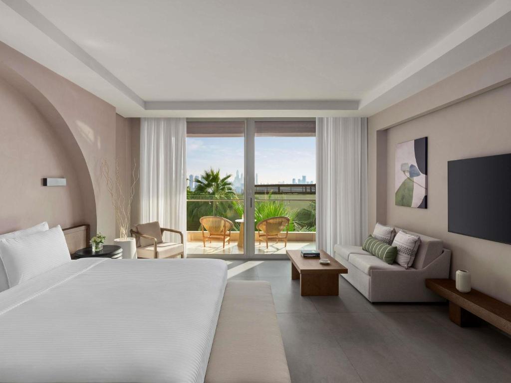 Ein Bett oder Betten in einem Zimmer der Unterkunft Rixos The Palm Hotel &amp; Suites - Ultra All Inclusive