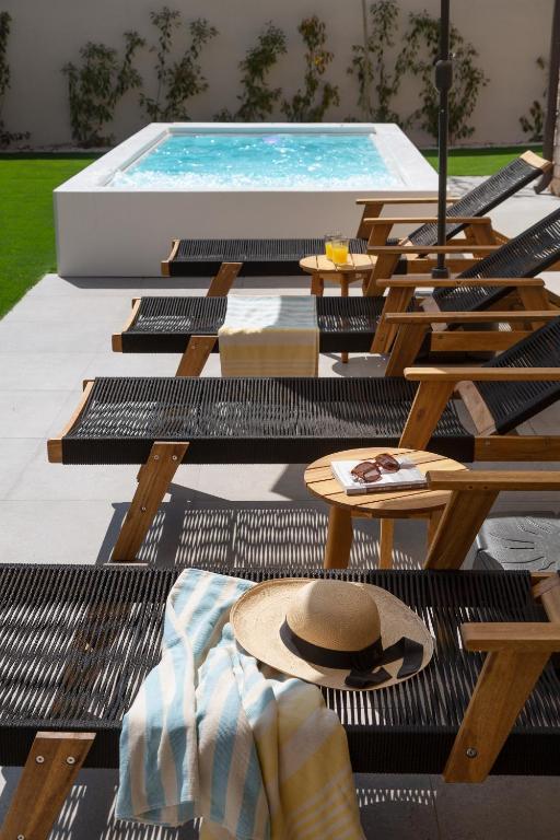 a group of picnic tables and a swimming pool at Villa Veg in Umag
