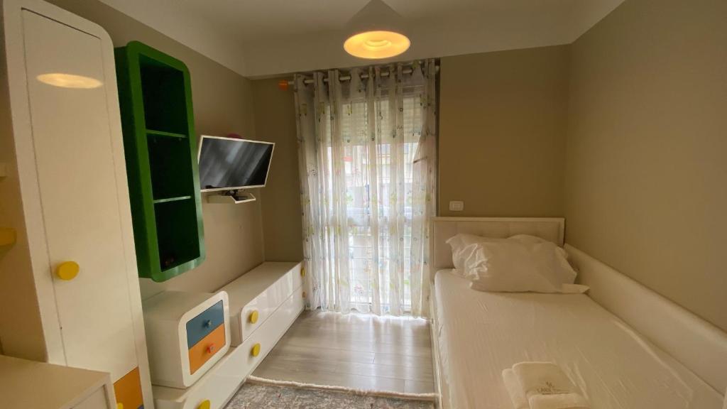 Postel nebo postele na pokoji v ubytování Lake Drive Rooms&Apartments
