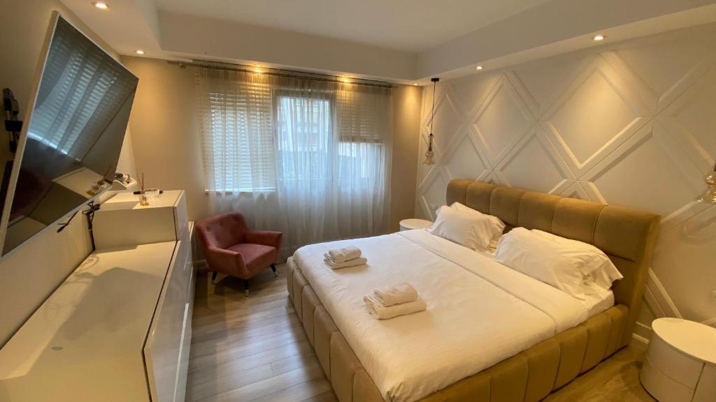 Postel nebo postele na pokoji v ubytování Lake Drive Rooms&Apartments