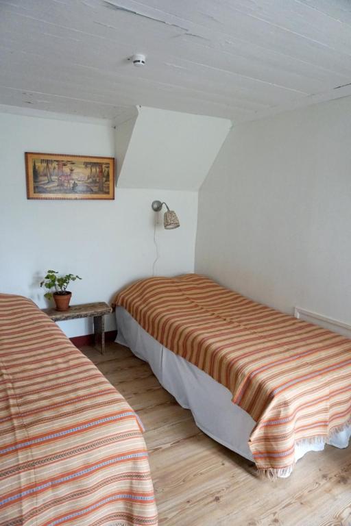 Postel nebo postele na pokoji v ubytování Åsens By