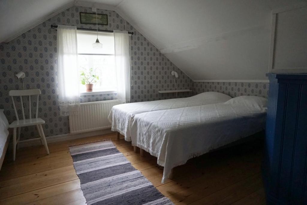 Postel nebo postele na pokoji v ubytování Åsens By