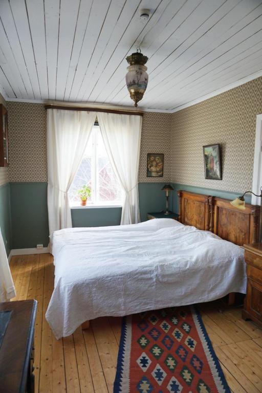 Postel nebo postele na pokoji v ubytování Åsens By