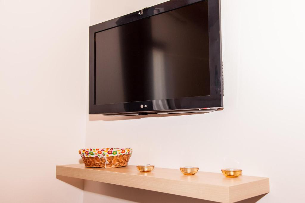 TV a/nebo společenská místnost v ubytování Apartments Bramado