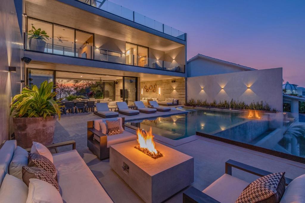 a house with a swimming pool and a fire pit at 3021 - La Montosa in Santa Cruz Huatulco