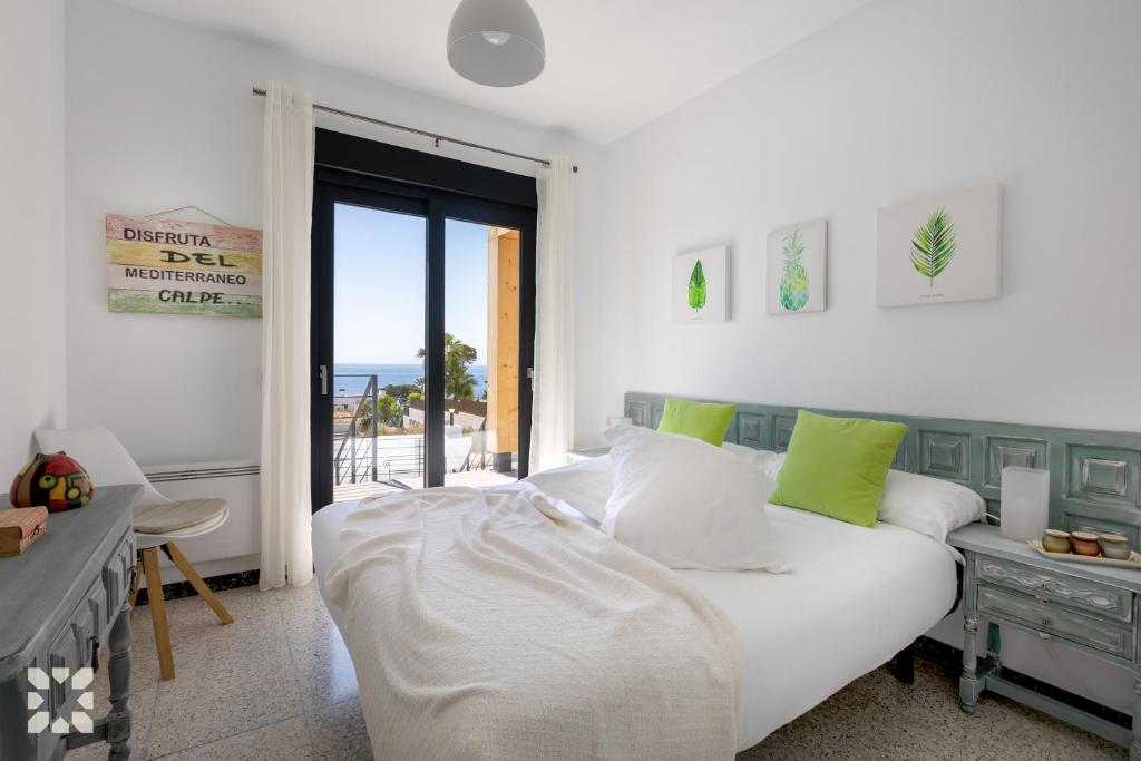 A bed or beds in a room at Villa Ipanema by Abahana Villas