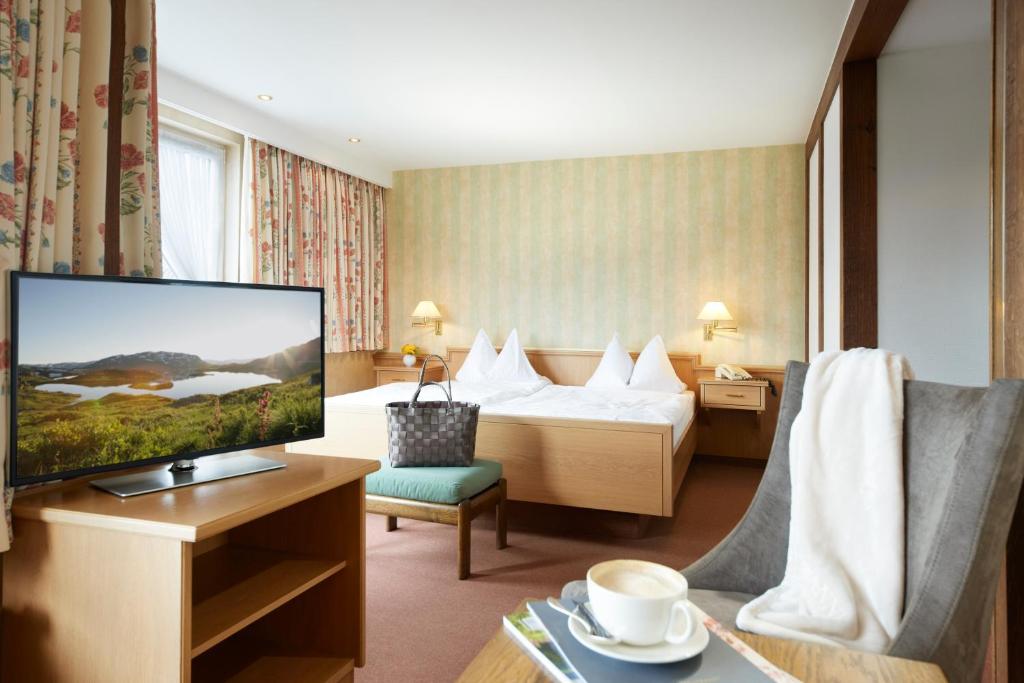 Postel nebo postele na pokoji v ubytování Romantik Hotel Störmann