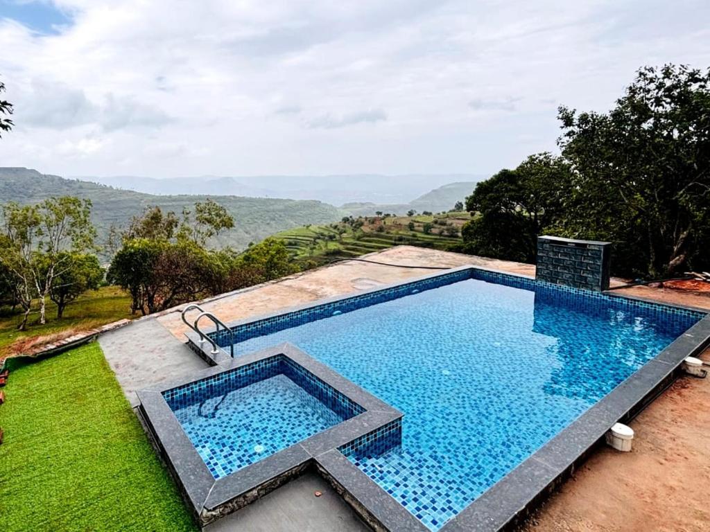 Πισίνα στο ή κοντά στο Navishka'S Villa