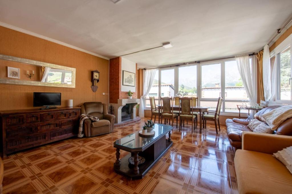 a living room with a couch and a table at La casa de Chachi in Potes