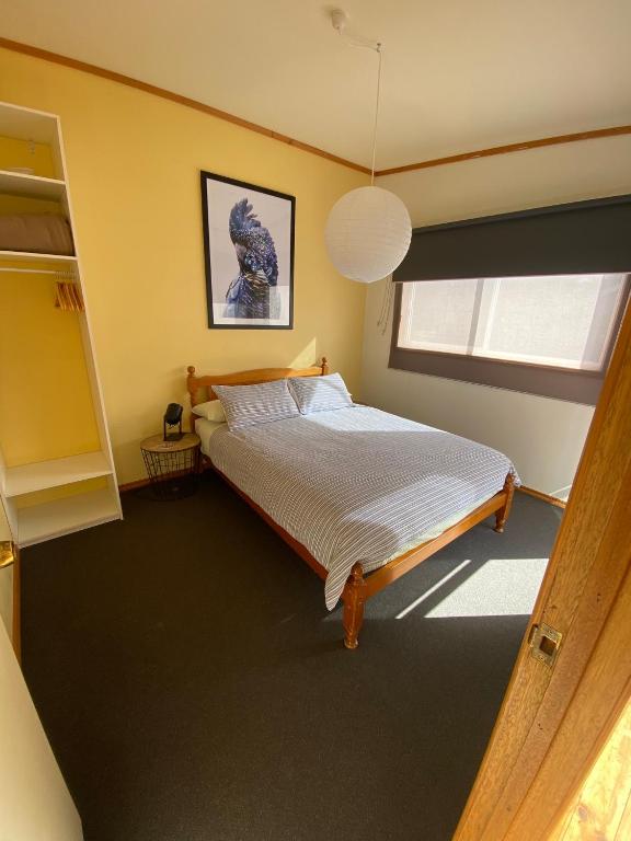 Postel nebo postele na pokoji v ubytování Clifton Beach Lodge