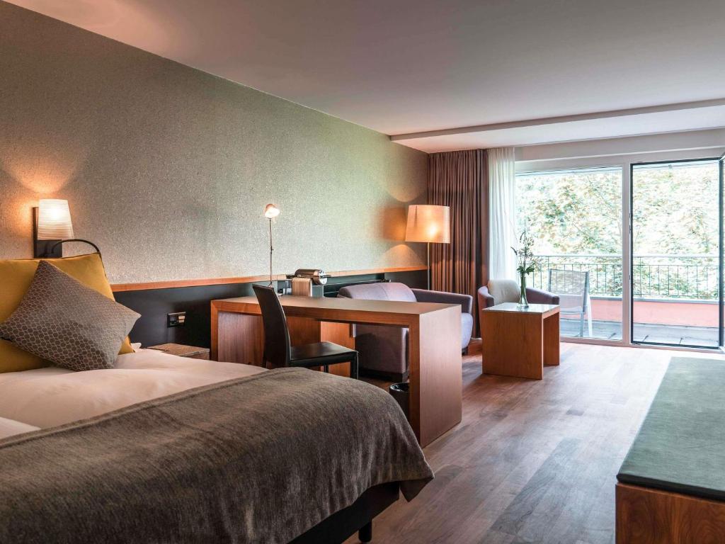 Postel nebo postele na pokoji v ubytování Royal St. Georges Hotel Interlaken - MGallery Collection