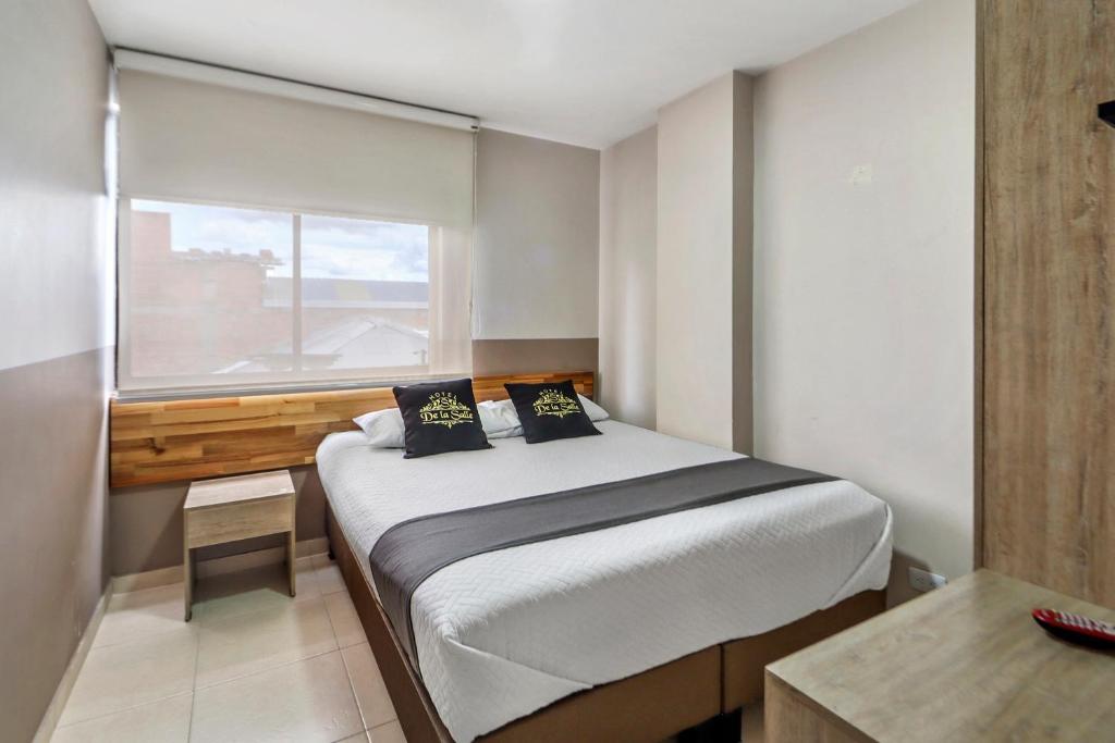 Postel nebo postele na pokoji v ubytování Hotel de la Salle