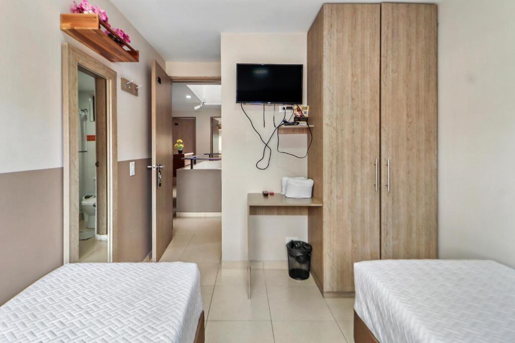 Postel nebo postele na pokoji v ubytování Hotel de la Salle
