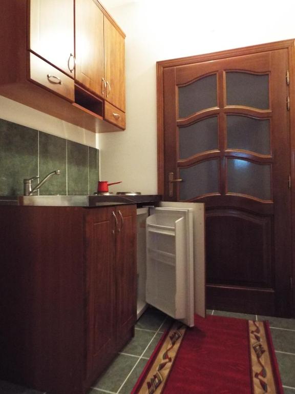 Kuchyň nebo kuchyňský kout v ubytování Apartments Old Olive