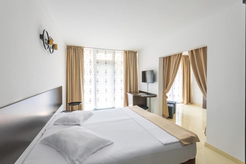 Postel nebo postele na pokoji v ubytování Hotel Recif