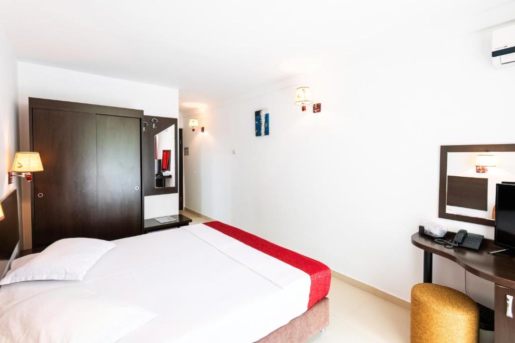 Postel nebo postele na pokoji v ubytování Hotel Recif